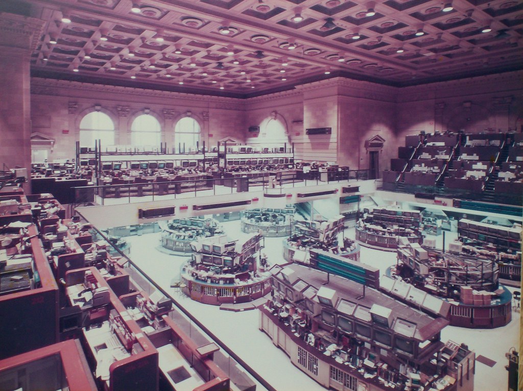 Historic American Stock Exchange trading floor — capital markets meet infrastructure