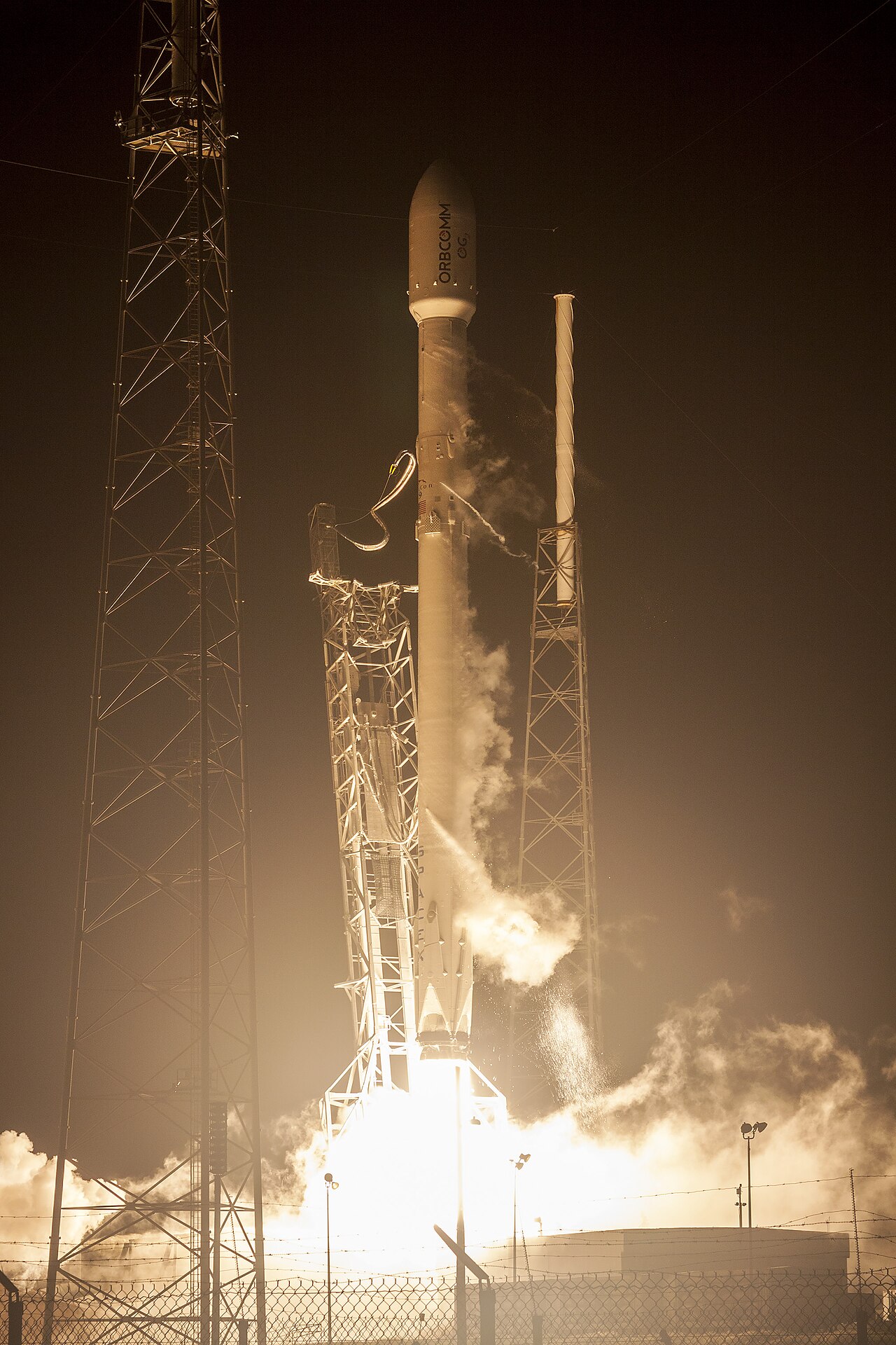 Falcon 9 rocket night launch ORBCOMM SpaceX reusable launch vehicle