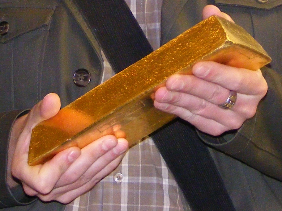 Gold bar bullion close-up physical precious metal storage